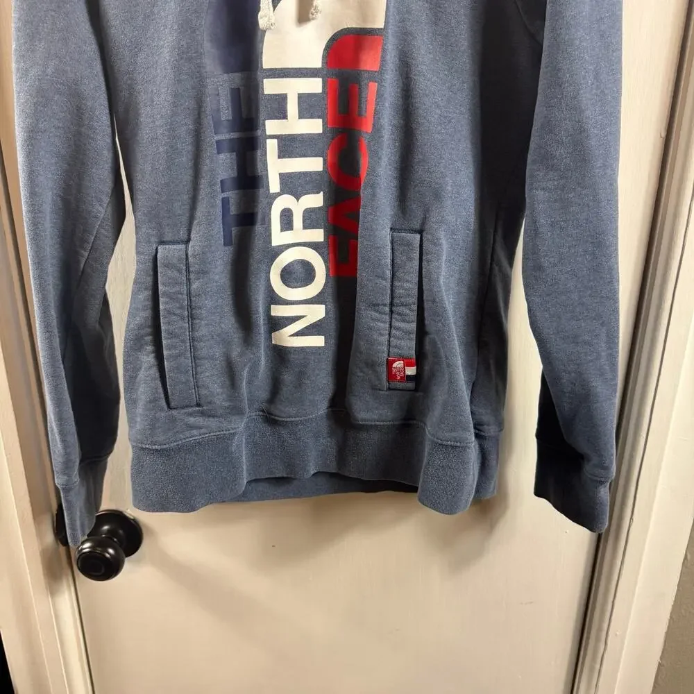 The North Face RU14 medium weight light blue graphic hooded sweatshirt